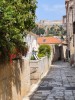 Streets of the old town with the view of the hilltop fortress, Hvar