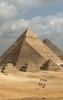 The iconic Pyramids of Giza rising from the desert landscape., Giza, Pyramids of Giza